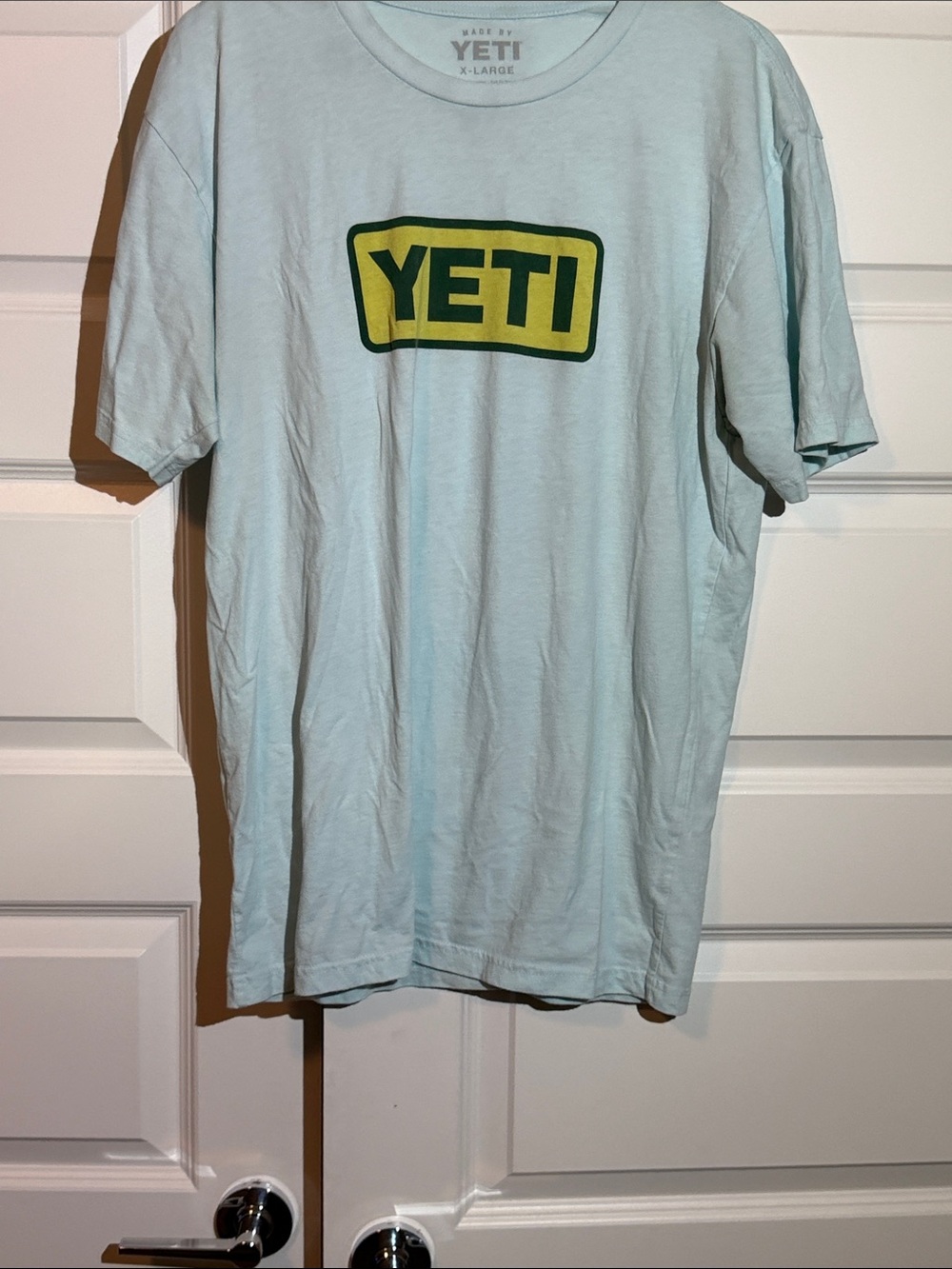 Yeti Light Blue Short Sleeve Tee with Yellow and Green Logo